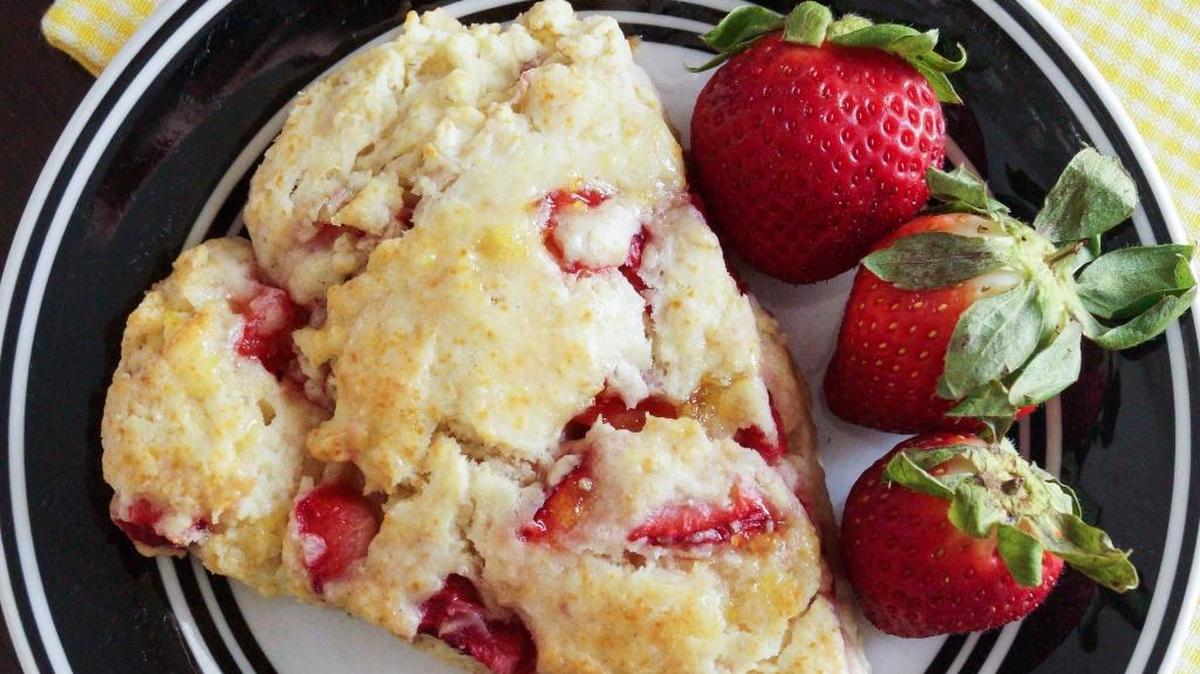 Strawberry Scones can be dressed up like shortcake with sliced berries, a little of the sweetened juices and some whipped cream on top.