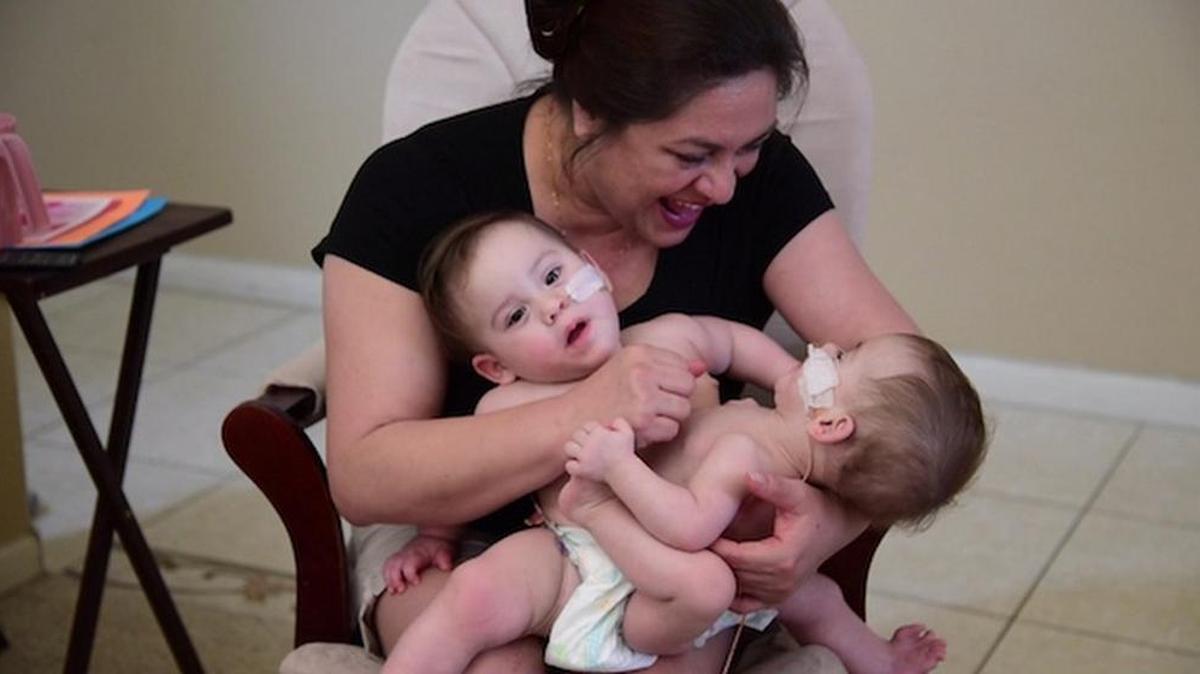 
The girls with their mother.
