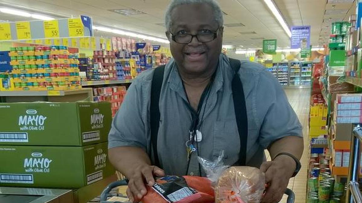 Clifford Broaden is taken to the grocery store by a volunteer through the Faith in Action to Service and Transform program of HealthVisions of East St. Louis.