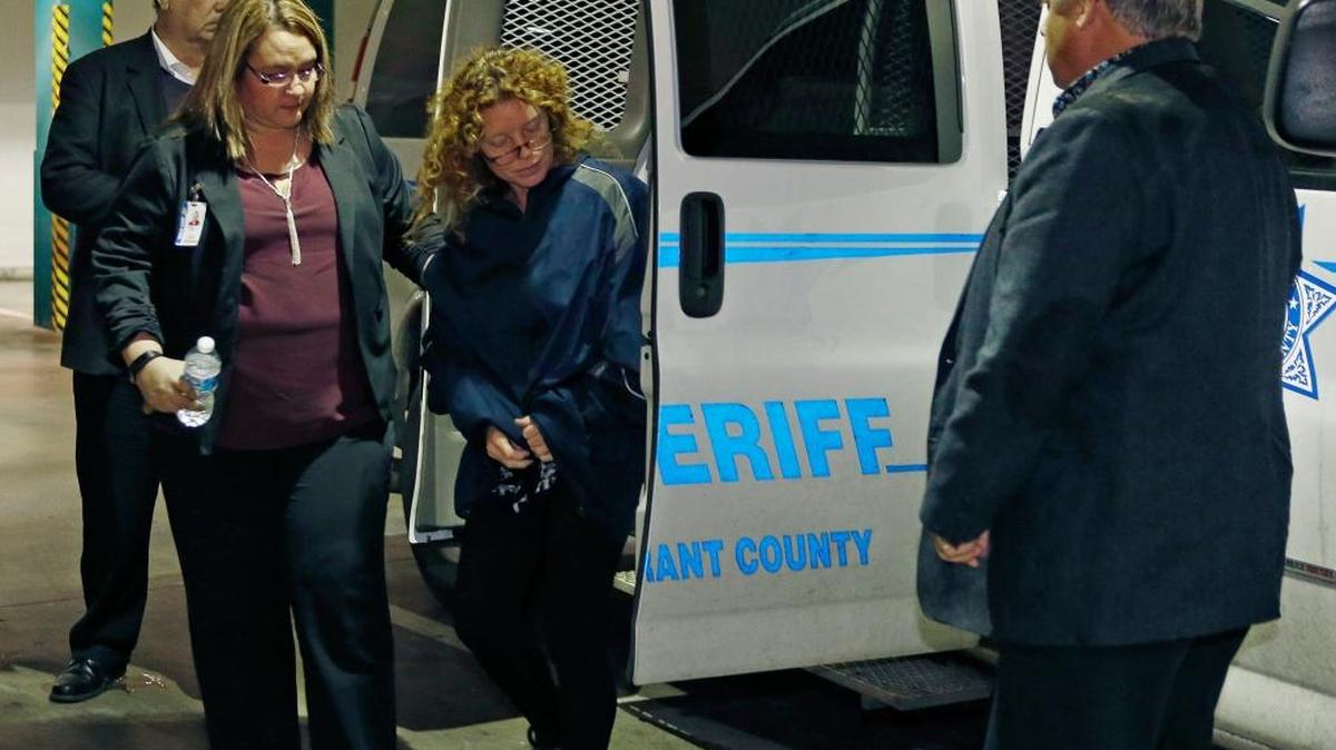 Returning to Texas from Los Angeles, Tonya Couch, mother of Ethan Couch, arrives escorted by sheriff’s deputies at the Tarrant County Jail in Fort Worth, Texas, on Jan. 7.