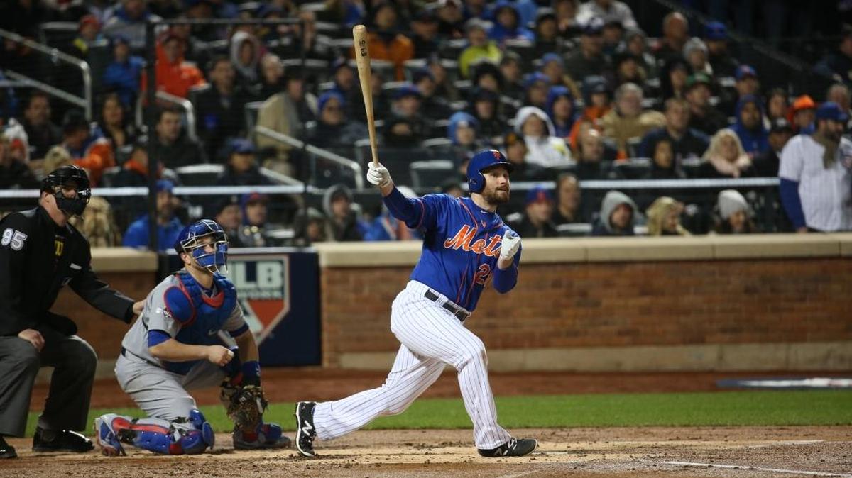 New York Mets second baseman Daniel Murphywatches his two-run home run in the first inning Game 2 of the National League Championship Series playoff Sunday at Citi Field in New York.