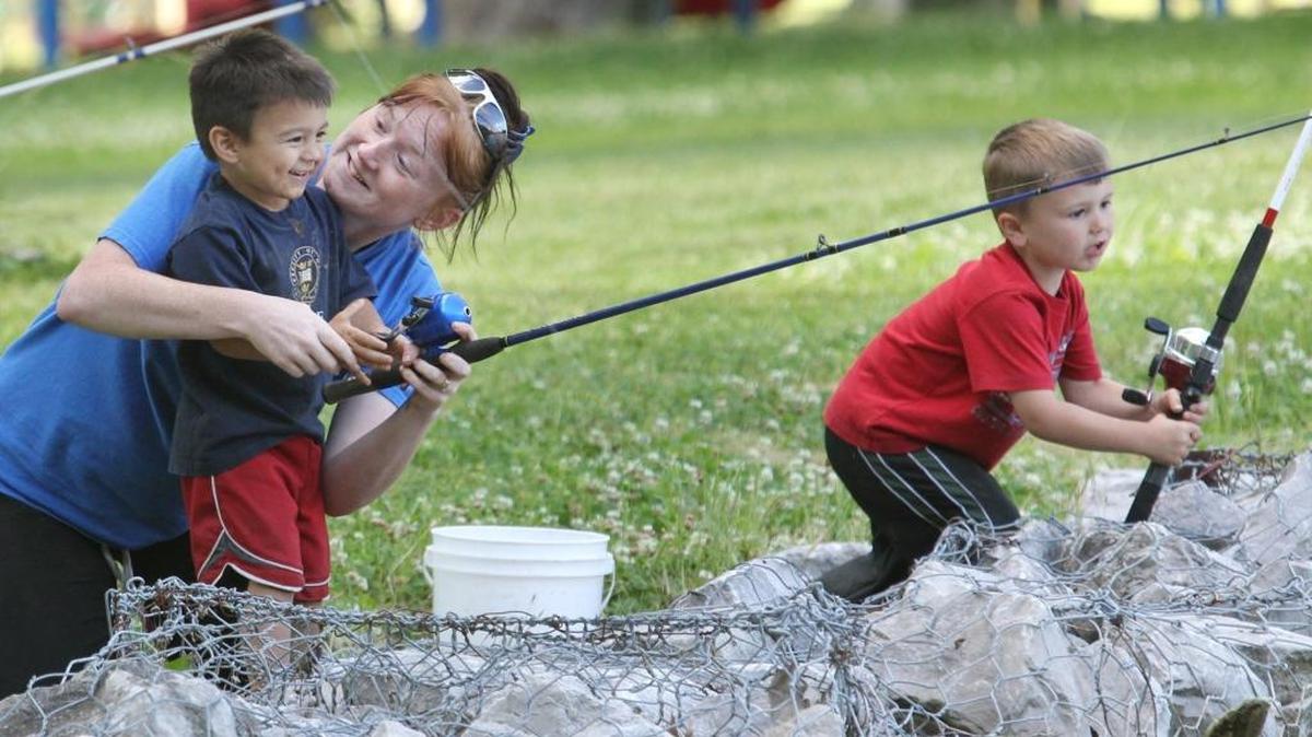 In this BND file photo, 3-year-old Pedro Martinez gets help casting from his mother, Dana Martinez, of Belleville, as 4-year-old Maddex Hankins checks his line, May 21, 2012, at South Side Park in Belleville.
