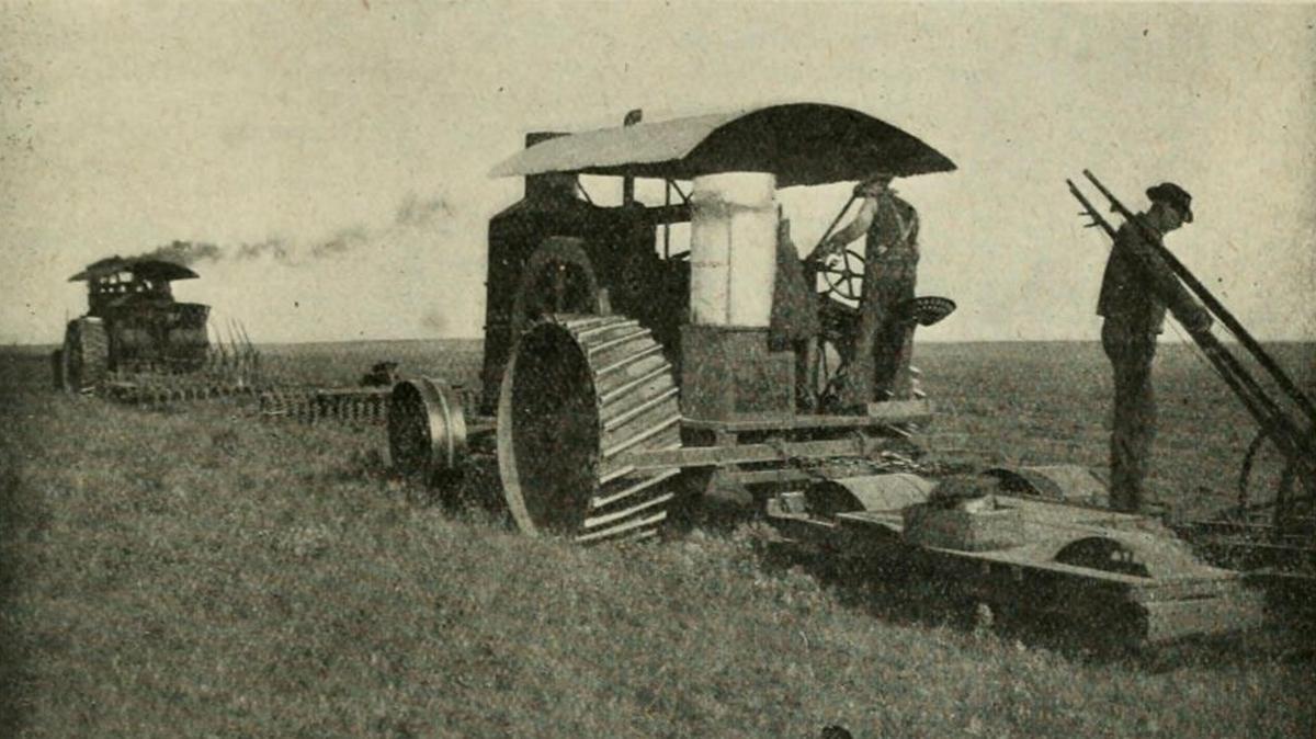 In this 1898 photo, a gasoline tractor pulls six plows in southern Alberta, Canada.