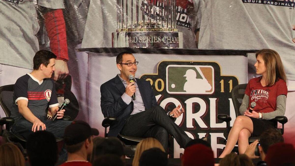 In this BND file photo, Cardinals General Manager John Mozeliak (center) is interviewed by KMOV television co-anchors John Knicely (left) and Claire Kellett on the main stage.