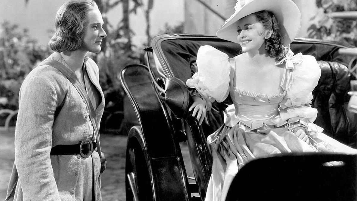 
Errol Flynn and Olivia de Havilland as they appeared in the hit picture “Captain Blood.” 
