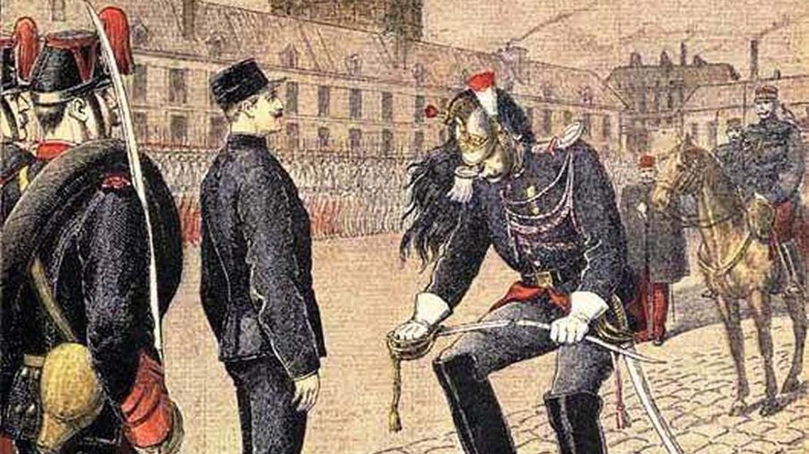 French officer Alfred Dreyfus shown during his degradation ceremony in 1894, when he was stripped of his rank and his sword broken for supposedly passing information to the Germans.
