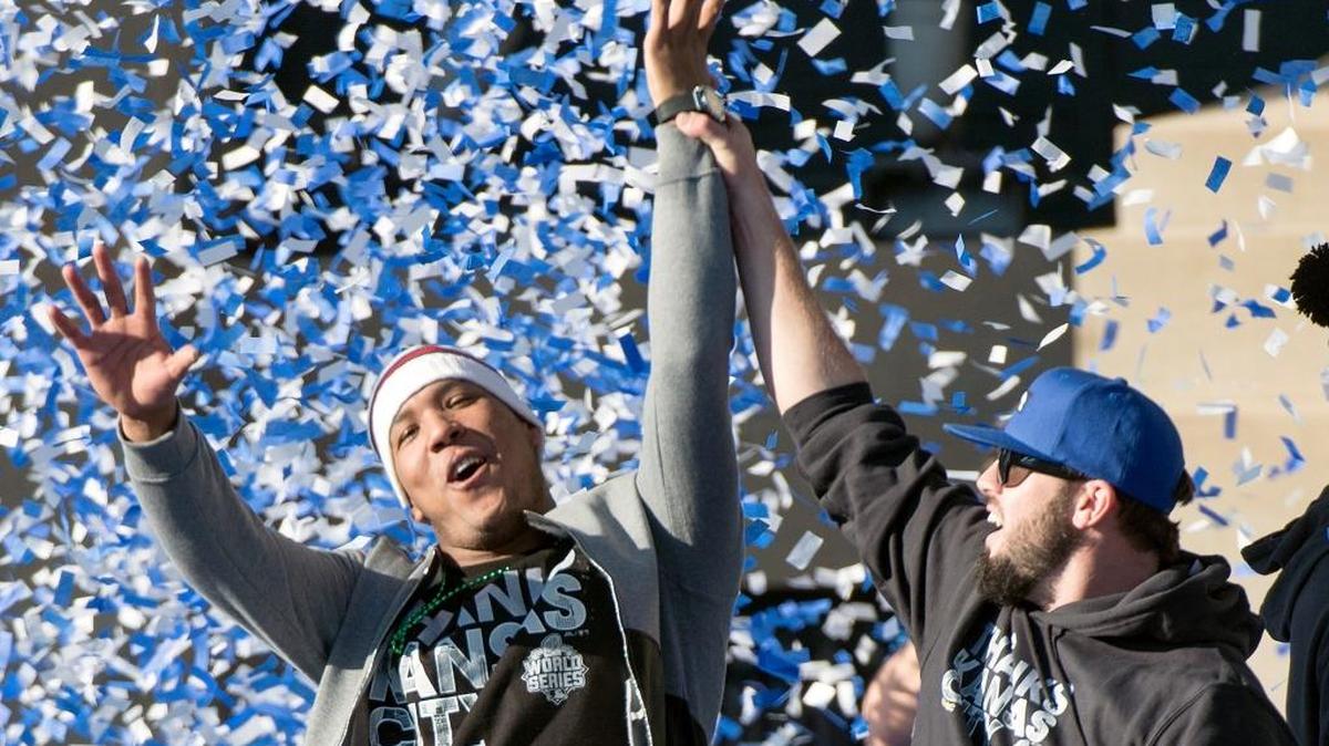 The Kansas City Royals’ Salvador Perez, left, and Mike Moustakas celebrate on stage during the team’s World Series rally on Nov. 3 in Kansas City.
