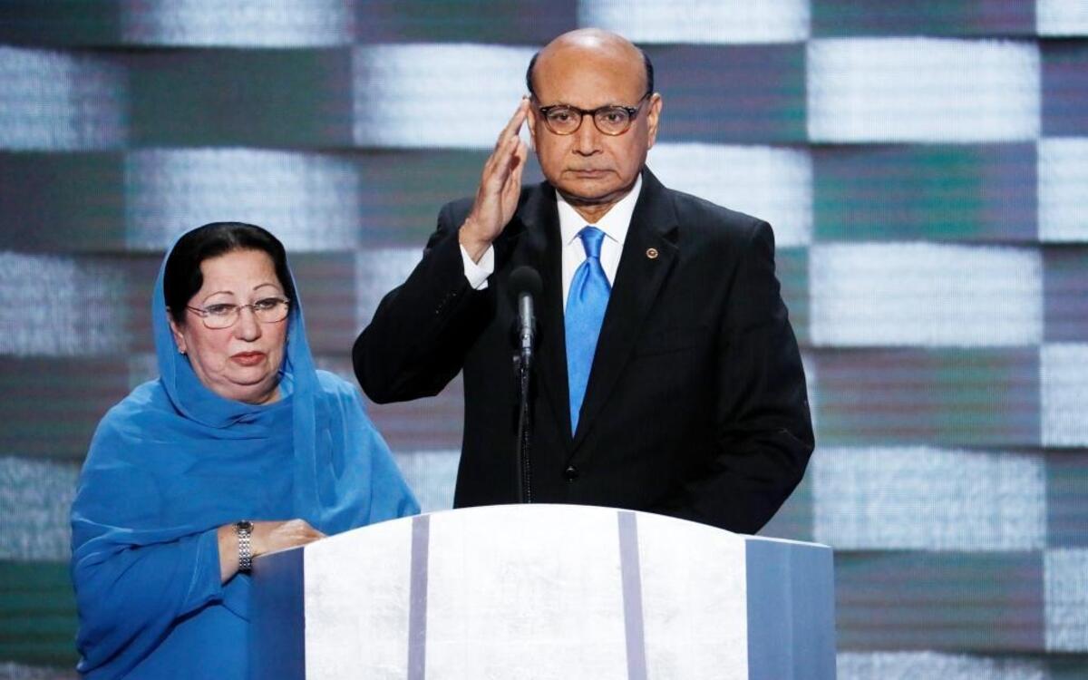 Khizr Khan, father of fallen US Army Capt. Humayun S. M. Khan speaks as his wife Ghazala listens during the final day of the Democratic National Convention in Philadelphia
