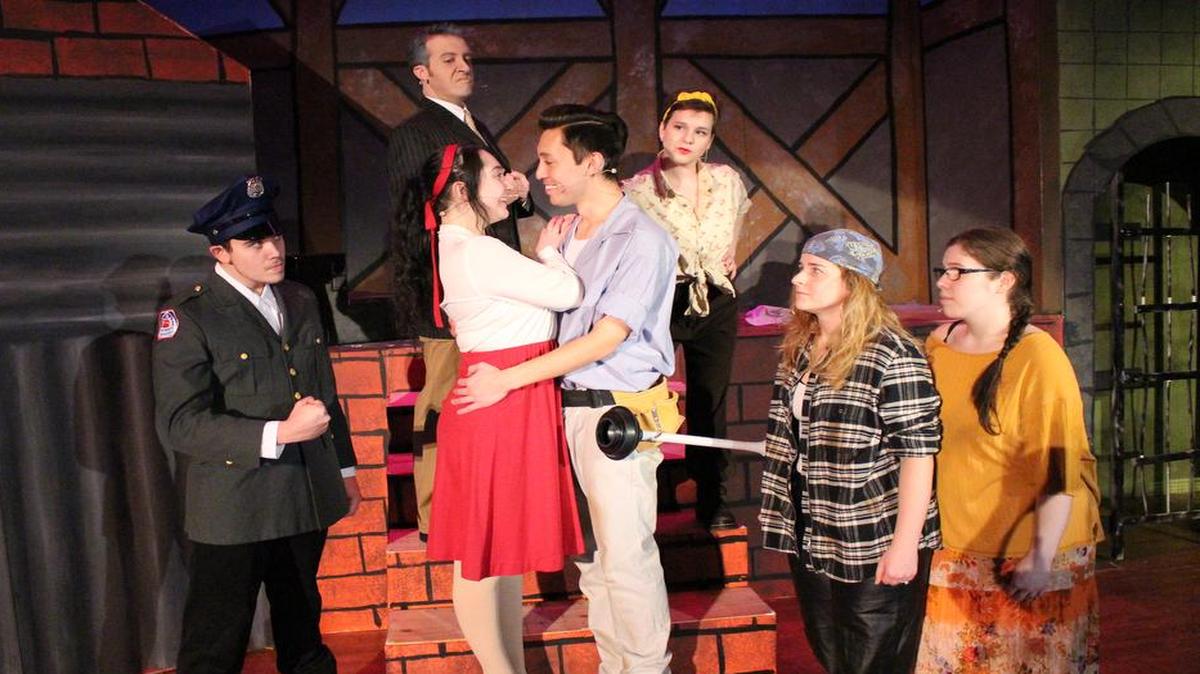Nico Bourgeais, left to right, Mark Neels (top of steps), Katie Landsbaum, Tim Kaniecki, Lauren Berkowitz, Ashley Netzhammer and Kaycee Warner rehearse a scene from “Urinetown: The Musical,” which will be performed Feb. 23-25 and March 3-4 at Lindenwood University in Belleville.