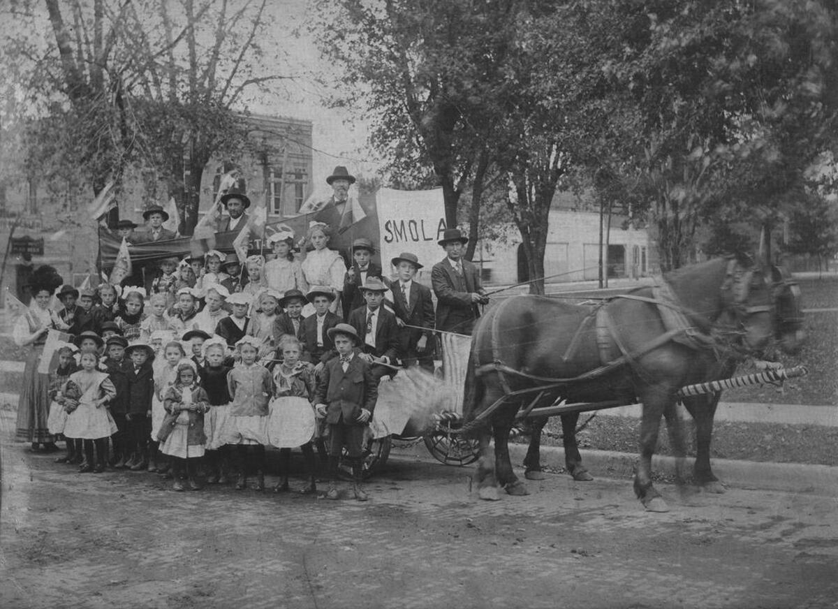 Girls and boys from Smola School in Glen Carbon wear their Sunday best to ride on a parade float in 1913. In those days, floats were pulled by horses, not pick-up trucks.