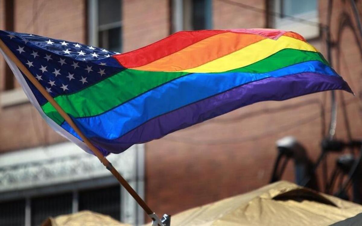 This variation of the Pride Flag — which is sometimes referred to as the LGBT Flag (for lesbian, gay, bisexual and transgender) — has the stars of the American flag in the corner plus the traditional red, orange, yellow, green, blue, and violet-colored stripes of a Pride flag. This flag was atop a booth at the fifth annual Metro-East PrideFest held in Belleville.
