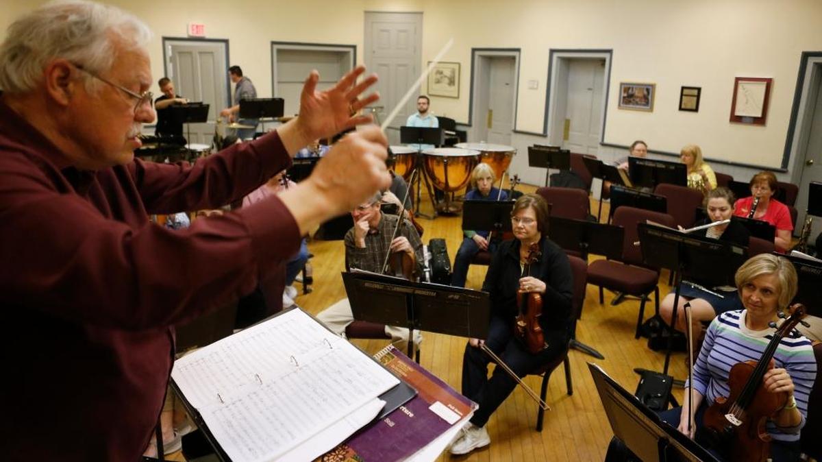 Robert Howard conducts the Belleville Philharmonic during a recent rehearsal. Howard is retiring as the director of the Belleville Philharmonic and moving to Colorado. His last concert with Belleville Philharmonic will be on April 30.