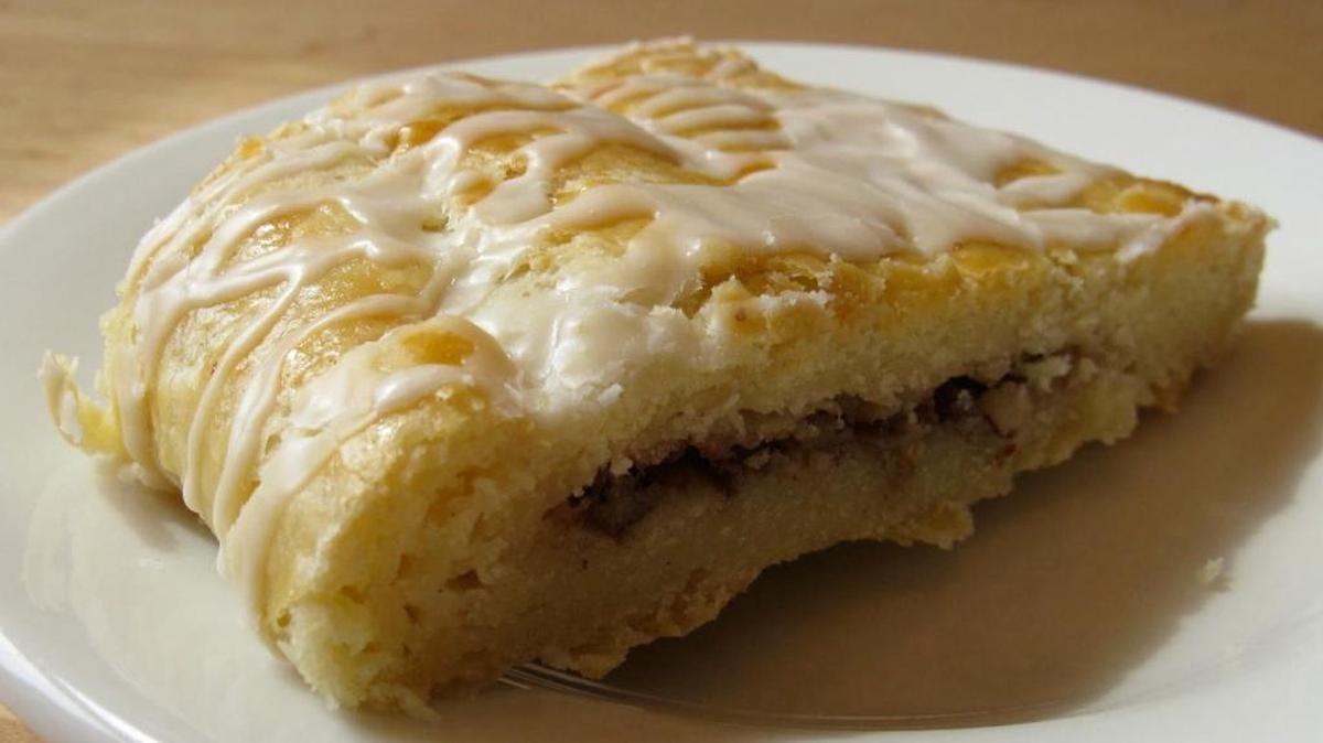 A large Danish should be cut in half, maybe in fourths to make bite-size pieces you can bring to your mouth with fork.