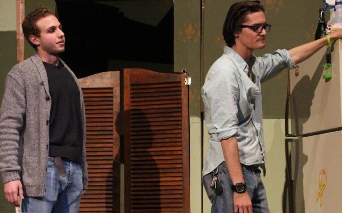 Colan Seipp, left, and London Rockwell rehearse a scene from Sam Shepard’s “True West.” The play features two estranged brothers living very different lifestyles. Their worlds clash as their double natures are revealed. See the play Friday, Saturday and Sunday at Southwestern Illinois College Belleville Campus theater. Check listing below for more information.