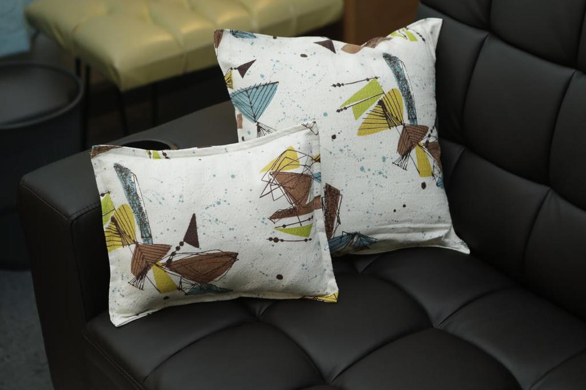 Margaret Meyer, Charles King adviser for Belleville Historical Society, used vintage ’50s fabric to make these throw pillows for Aunt Vi’s Apartment.