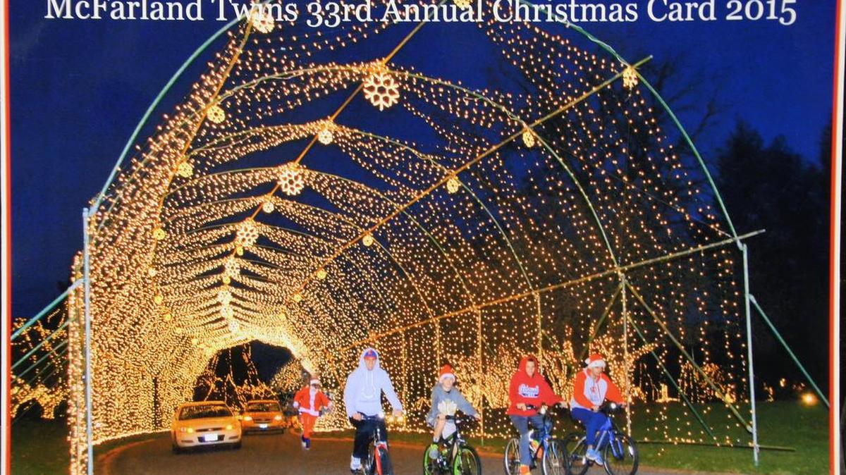 The McFarland boys ride through the archway at the National Shrine of Our Lady of the Snows and onto the annual Christmas card their dads, Kevin and David, created. From left, Jordan, Colin, Mason and Brendan.
