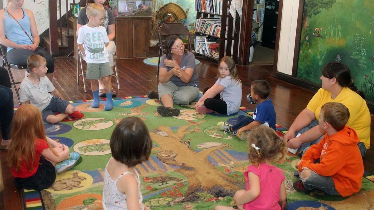 
Patty Brown, center in gray T-shirt, introduces children to amphipods during a monthly Knee-High Naturalist class at The Nature Institute in Godfrey. An amphipod is a small shrimp-like creature that lives in the pond. “We also call them side swimmers because they look like they are swimming on their sides and they are,” said Patty.
