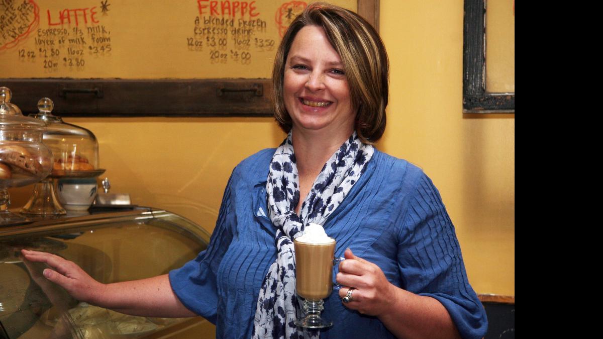 
Victoria Arguelles serves breakfast, lunch and dinner at her Kool Beanz Cafe in Granite City. 
