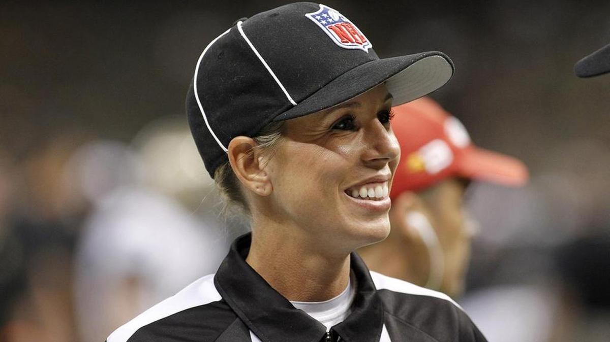 
NFL official Sarah Thomas keeps her blond hair tucked under a ballcap during games.
