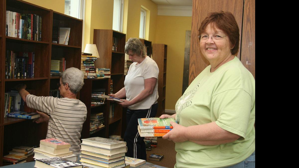 
Jane Peiffer, left, bought a former bank building in Prairie du Rocher that is now the town's library.
