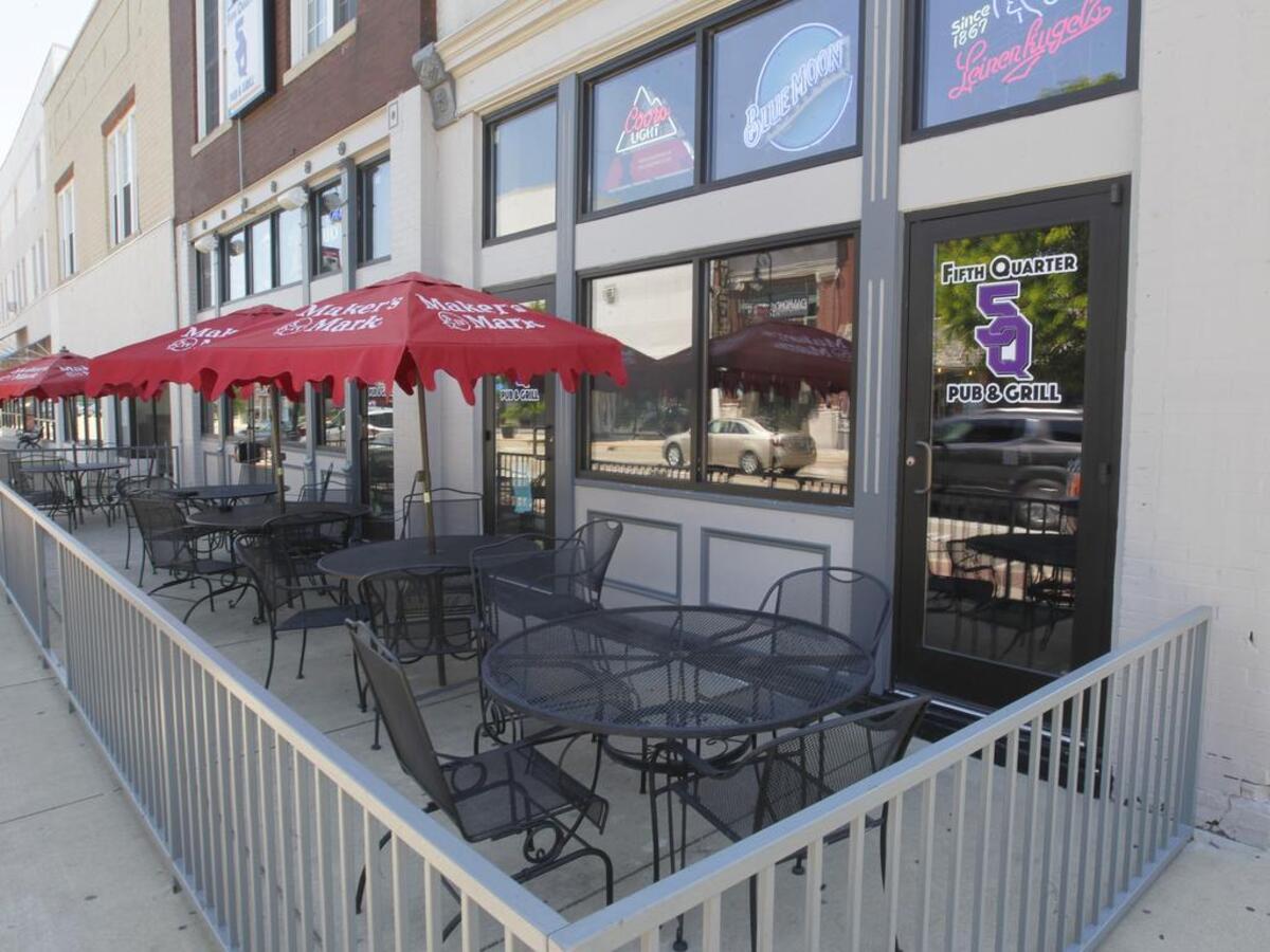 Fifth Quarter Pub & Grill has umbrella tables on a small patio along East Main Street in Collinsville and a larger, partially covered patio with a new bar in back.