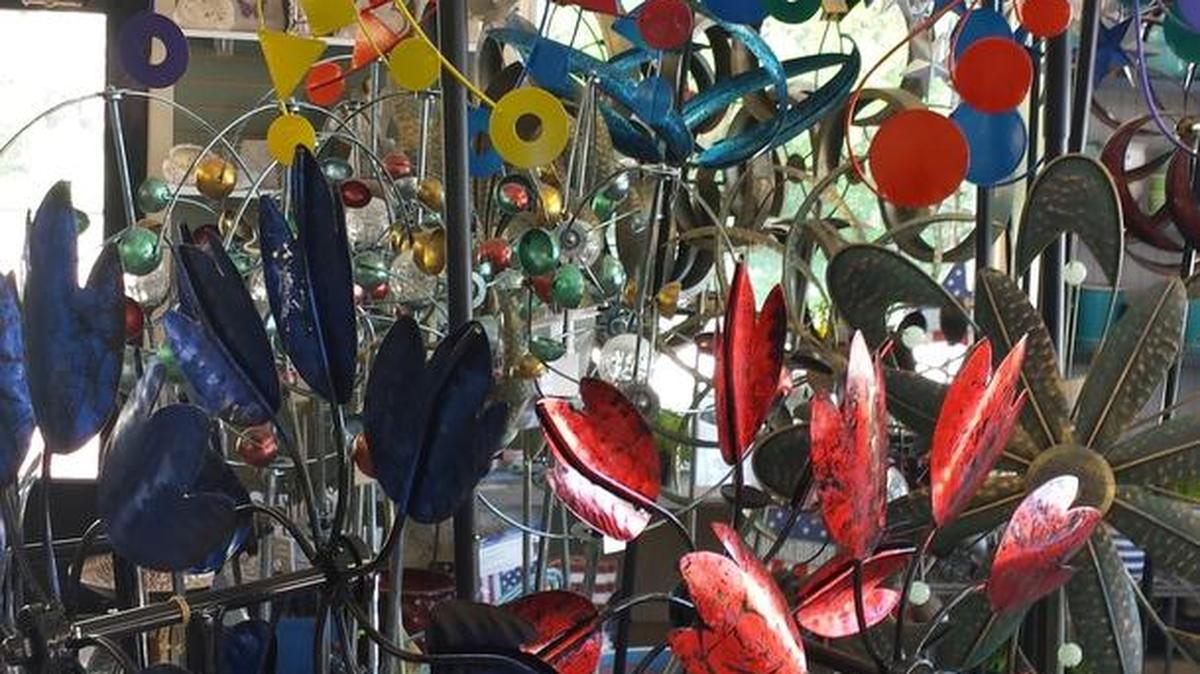 Metal garden whirlygigs come in many heights and styles at Sandy’s Back Porch garden center in Belleville.