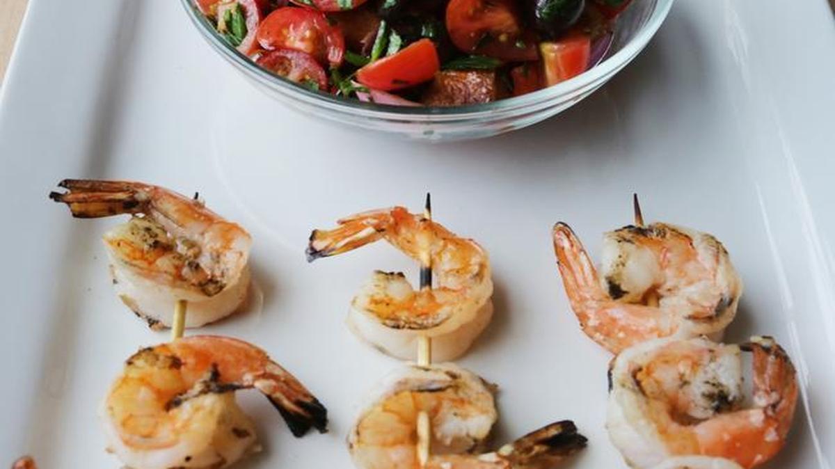In Grilled Shrimp with Bread Vegetable Salad recipe, the shrimp is brushed with a mix of olive oil, fresh lemon juice, garlic, salt and pepper. You can grill, pan-saute, broil or bake the shrimp.