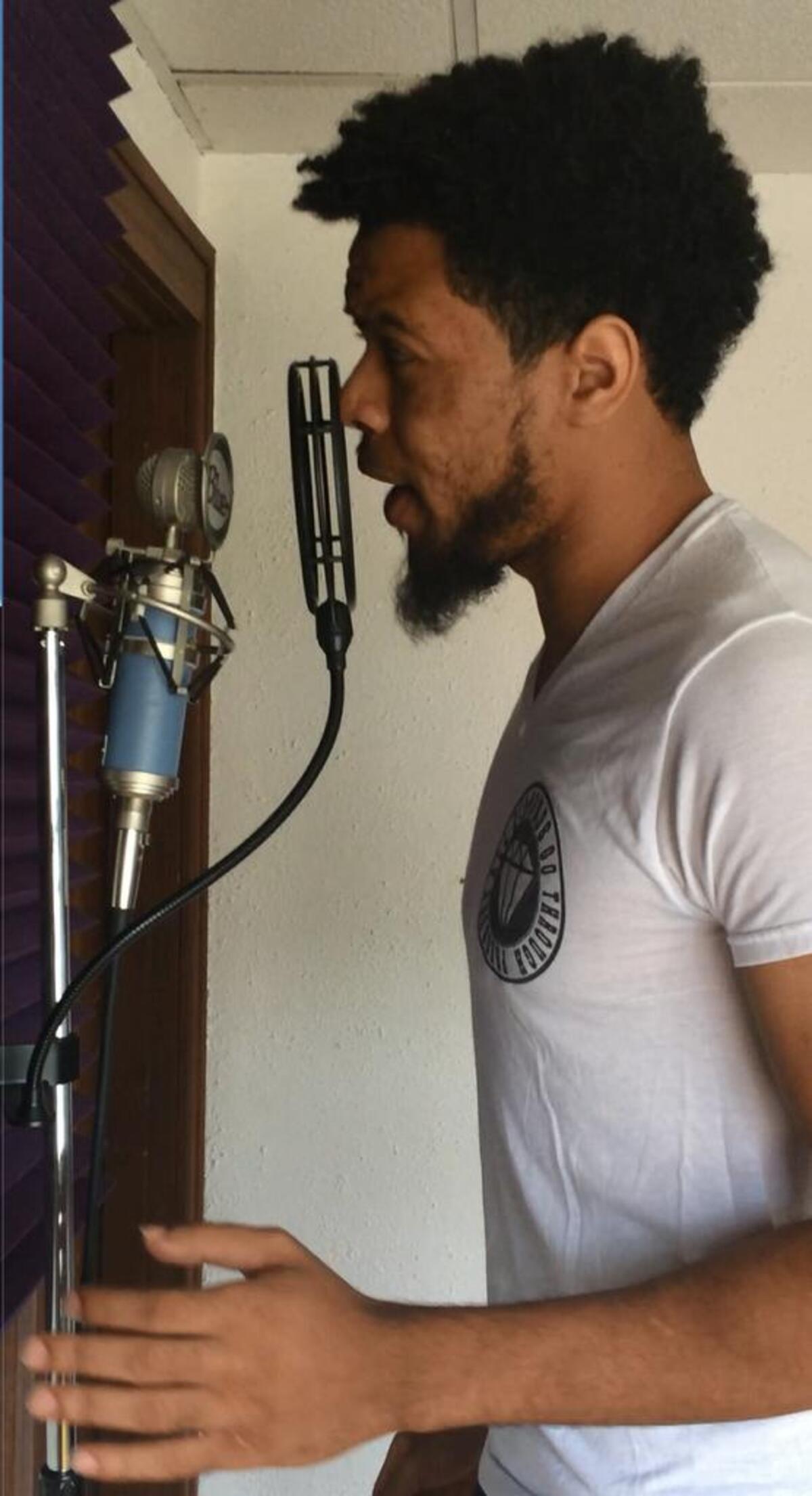 Anthony Lucius records the song, “Six Feet Under” in his Belleville studio.