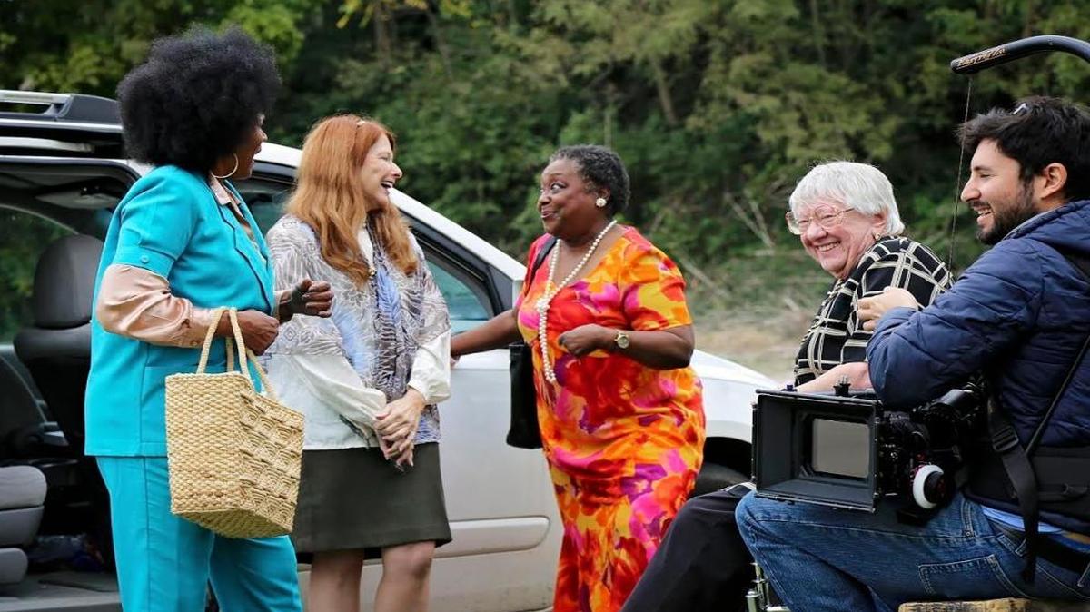 Actors Relanda Ledbetter, left to right, Donna Delaney Cokenour, Helen White and Janet Baechle work with cinematographer Brett Frager on the set of “The Racket.”