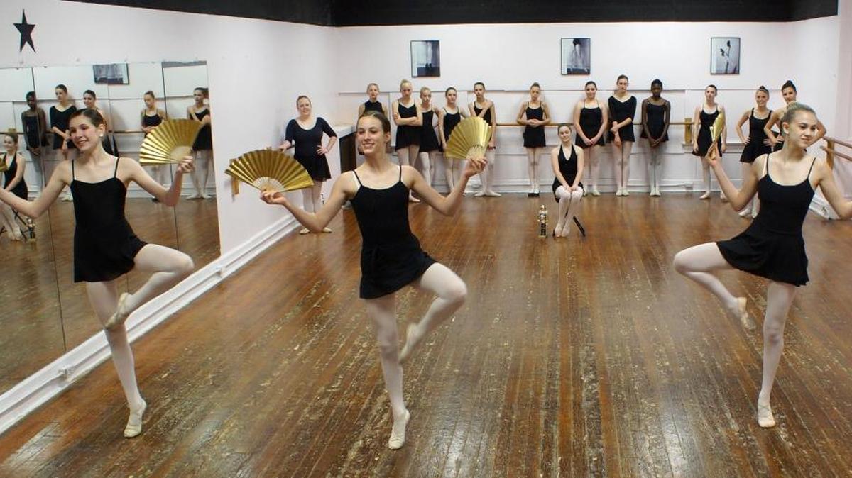 Kayla Sanders, left, Amanda Bradley and Clarissa Pavao dance a scene from “The Nutcracker” at a recent reheasal.