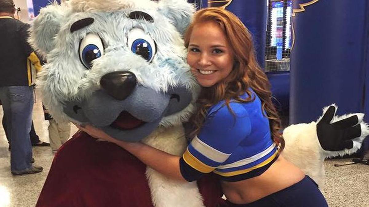 Alixandra on the Blue Crew with Blues mascot Louie.
