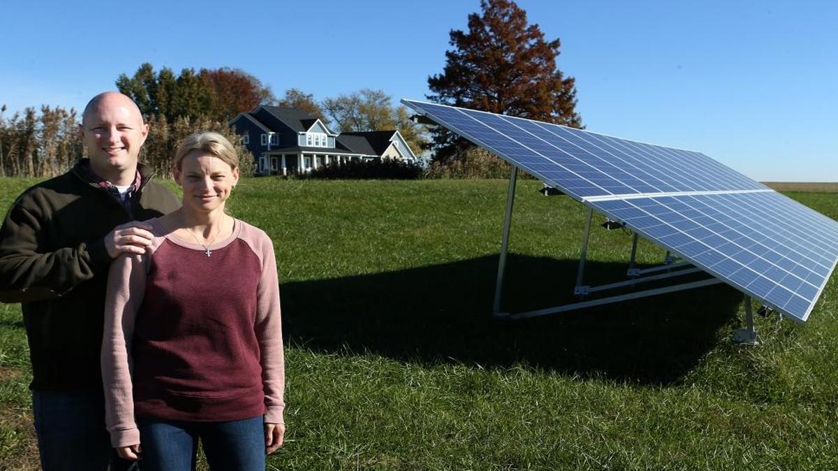 Brian and Allison Hart’s new home has a solar panel in the front yard that supplies most of the home’s energy needs.