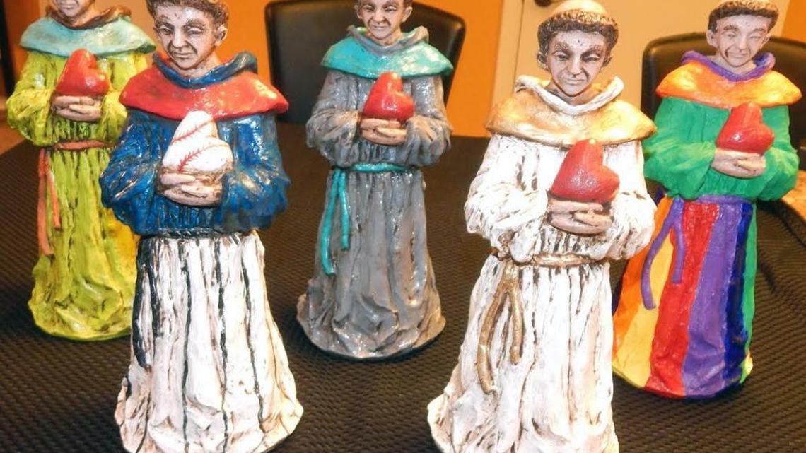 Several customized St. Anthony statues that were painted in special colors for a Cubs fan, Pride supporter, sorority and personal favorites.