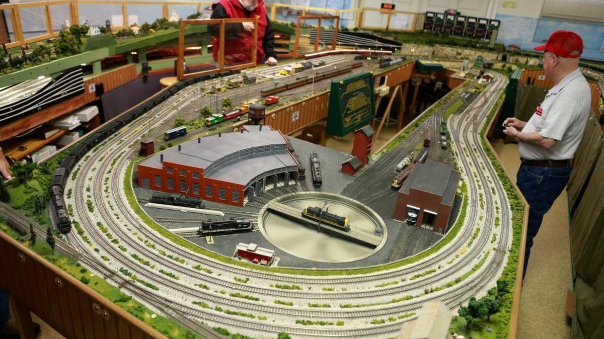 Metro East Model Railroad Club members Tim Johnson, left, and Bill Birdsell, prepare their 18-by-27-foot, HO Scale railroad for an open house on New Year’s Eve in the old Glen Carbon Firehouse and Village Hall.