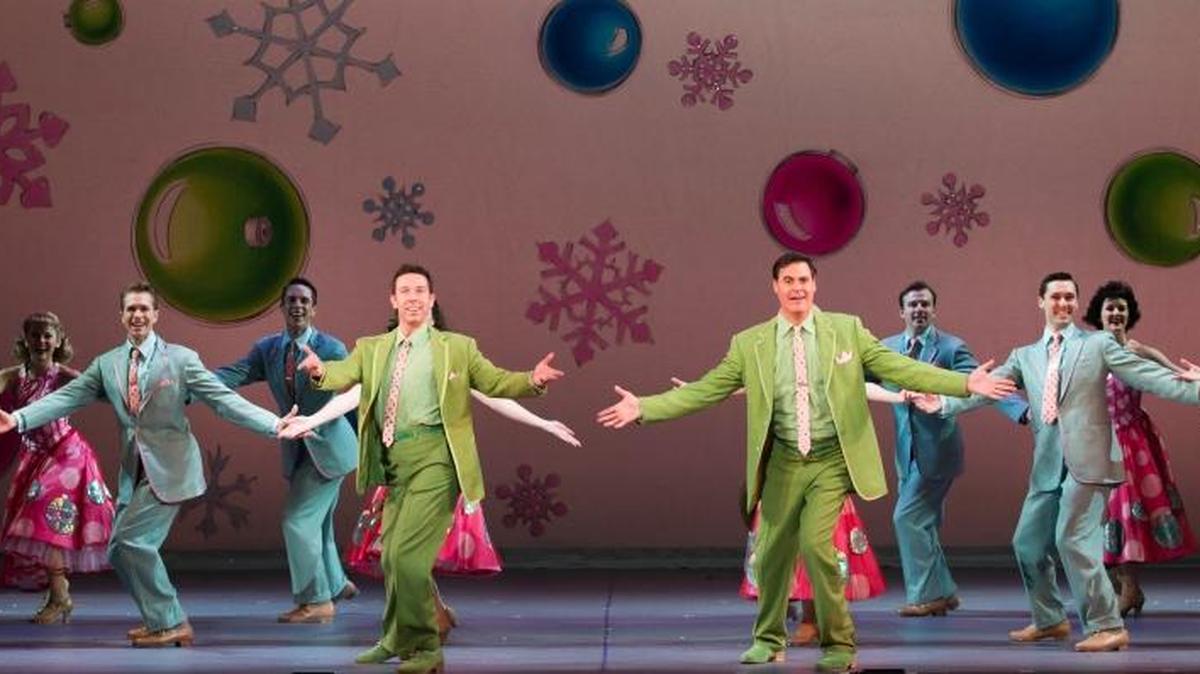 Joe Grandy, fourth from left, dances in a holiday number from “White Christmas,” which is playing through Sunday at the Fox Theatre.