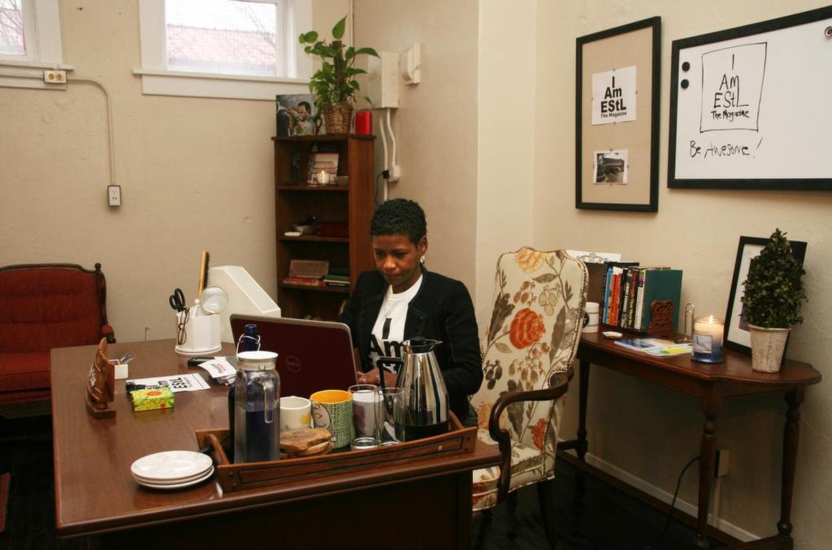 Charmaine Savage works in her East St. Louis office. She and husband Lorenzo are renovating the 20,000-square-foot building at 25th and Lincoln that includes apartments and will one day house a coffee shop.