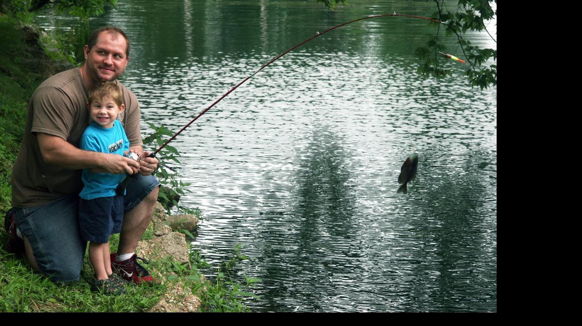 
Dad Dino Clifford, of Granite City,and son Calvin, 2, didn't have to fish long before they caught a fish in Leclaire Lake in Edwardsville.
