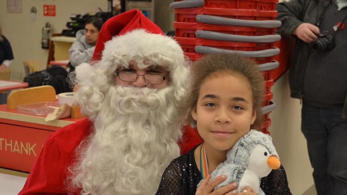 Local O’Fallon-Shiloh area youth Christina Harvey-Ervin sits on Santa Clause’s lap last year.
