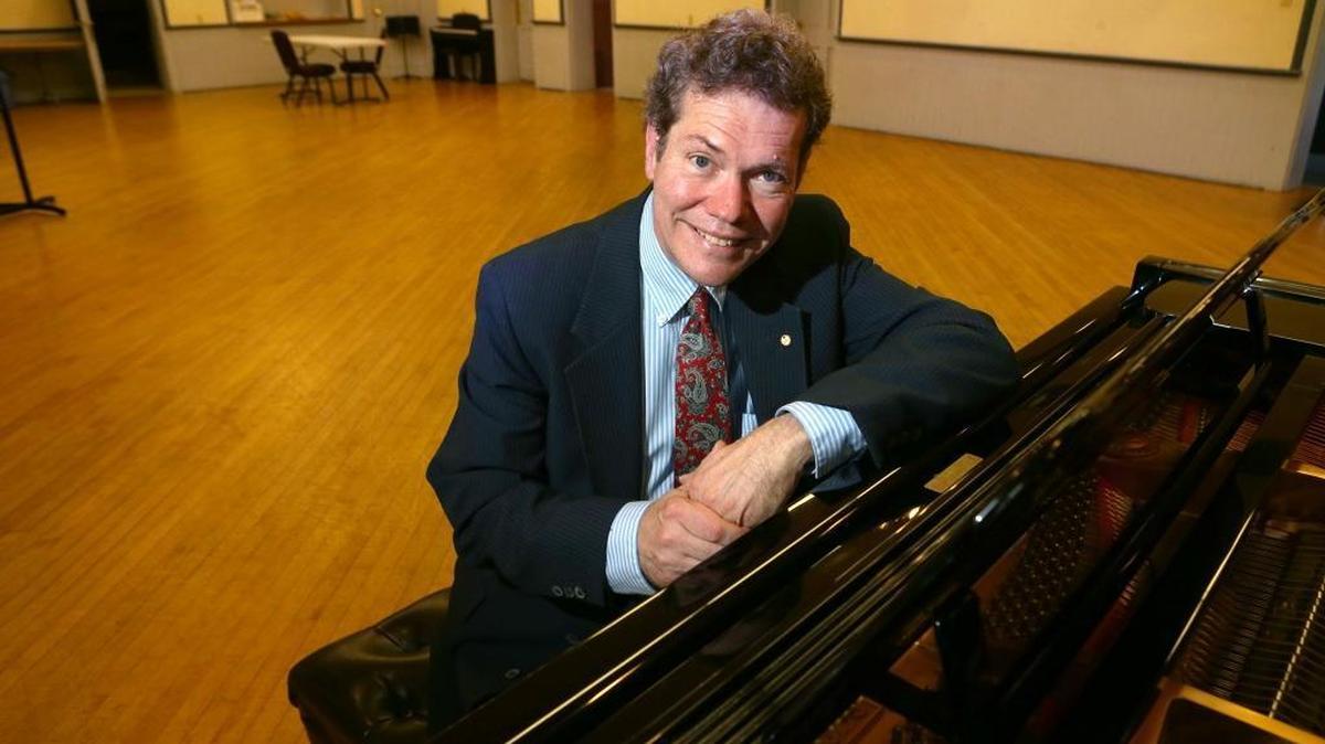 Robert Hart Baker poses at the piano shortly after the Belleville Philharmonic Society board hired him as music and artistic director and orchestra and chorale conductor in 2016.