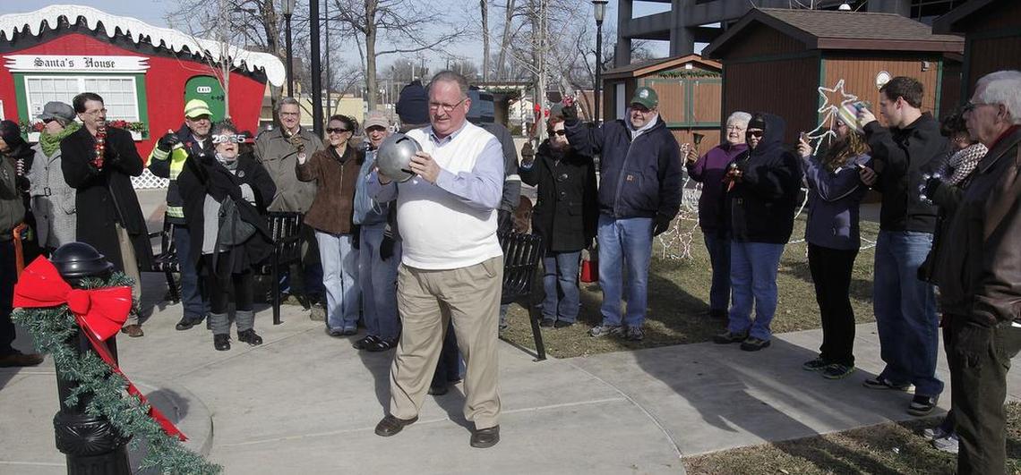 People gathered on the northeast quadrant of Public Square at noon on New Year’s Day to ring in 2015 using a variety of bells of all sizes and sounds. Belleville Mayor Mark Eckert (center) lead the bell-ringers for two minutes of ringing.