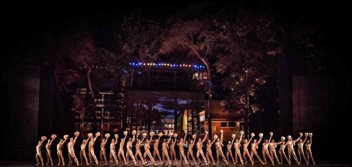 Cast of “A Chorus Line” at “One” finale. Lifting the back cyclorama wall had never been done before at the Muny.