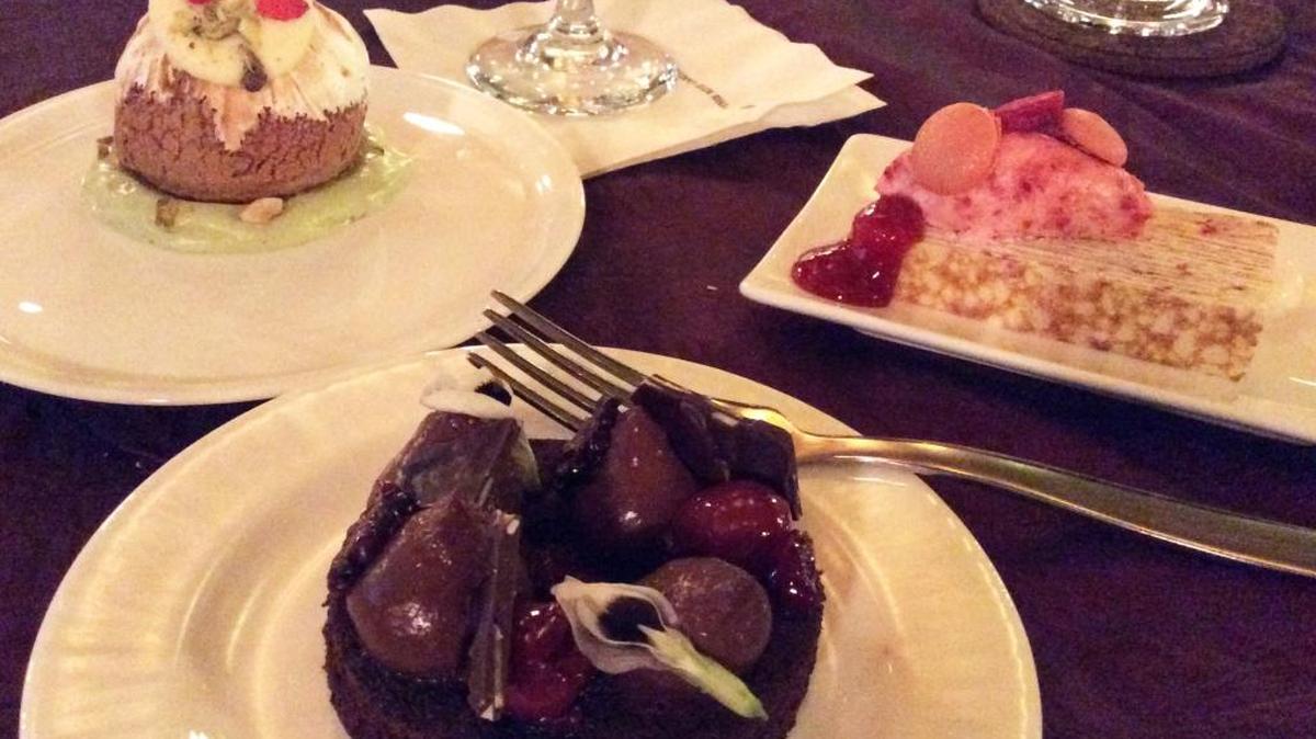 Choose a dessert at the Soiree d’Amour Valentine’s Day dinner at the Ritz-Carlton will be difficult. Left: Dauphine de Strawberry, Rose Petal, Pistachio Nougat Mousse, Pink Peppercorn Meringue. Right: Liaison Raspberry White Chocolate Tiramisu Crêpe Cake. Forefront: La Forêt-Noire Preserved Blackberries, Wine-Soaked Black Cherry Gelée, Vanilla- Scented Yogurt Mousse, Soft Chocolate Cake.