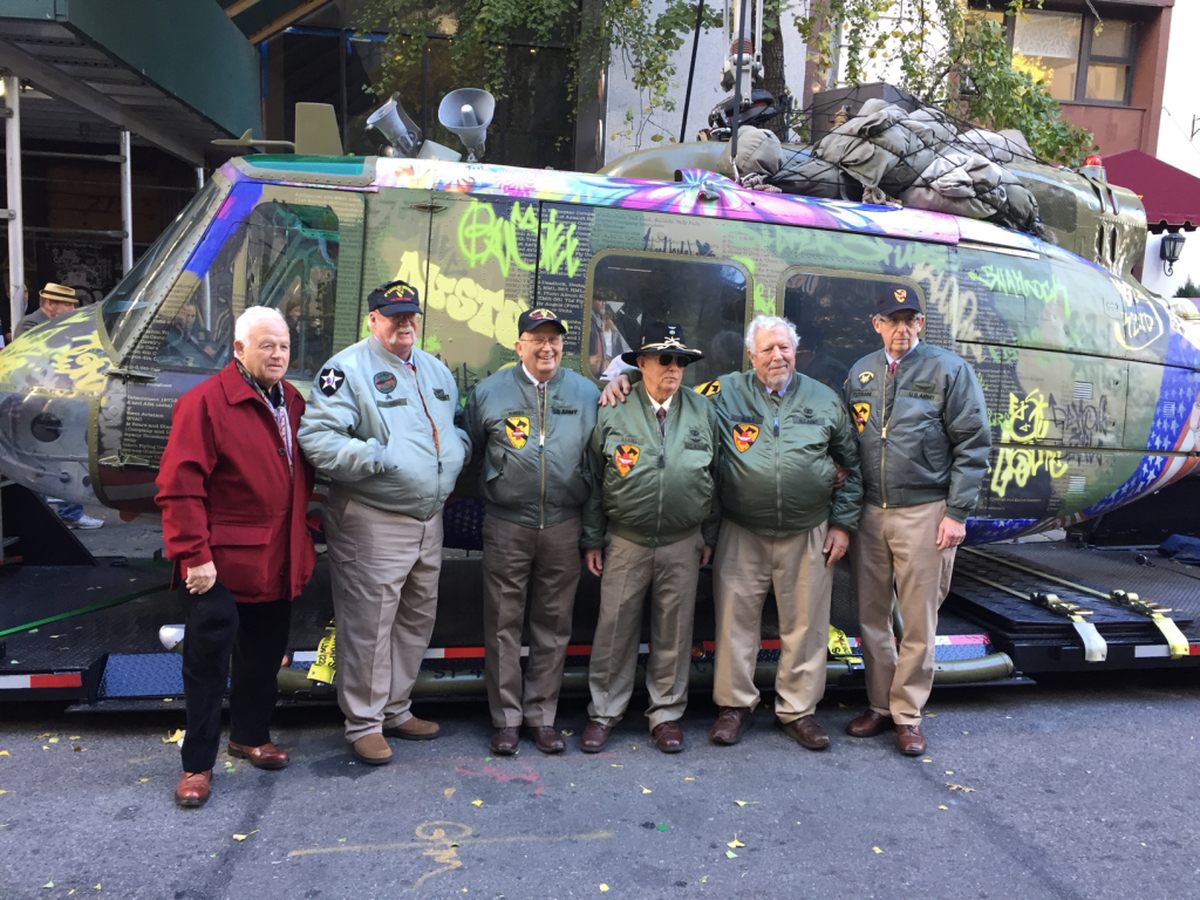 Left to right, artist Steve Maloney, who created a mixed-media sculpture out of a U.S. Army helicopter from the Vietnam War, poses with Dave Barron of Light Horse Legacy, which salvaged the aircraft; and former crewmen Walt McNees, Dave Adams, Dr. Eric Berla, a Waterloo dentist; and Ralph Tutrani.