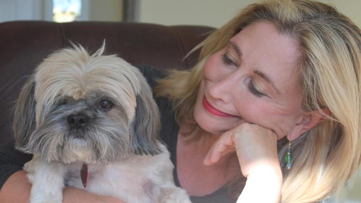 Michelle with her one-eyed Shih-Tzu, Captain Jack.