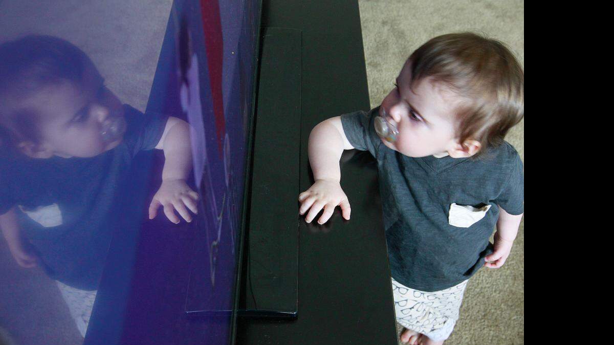 
Charlie Dolan has trouble seeing shapes on the television screen unless he is within a few inches of the screen. 


