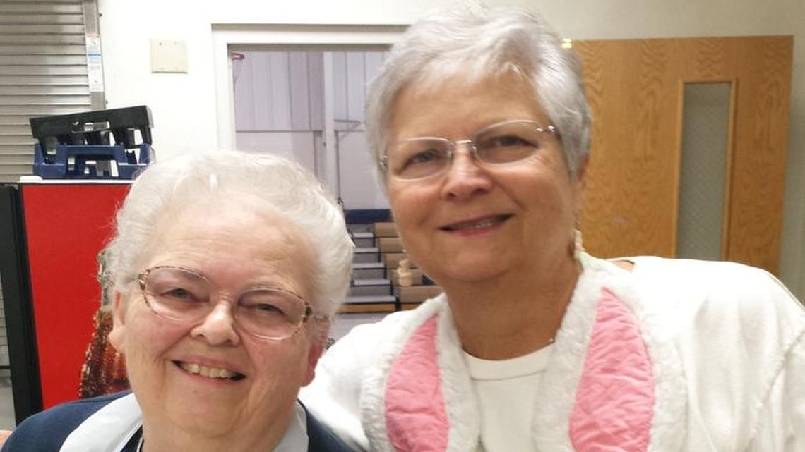 Rose Neff, left, and Cathy Rickard are two of the original members of the St. John the Baptist Catholic Church women’s club in Smithton who started 30 years ago making and selling Easter cookies to help raise funds for the school.
