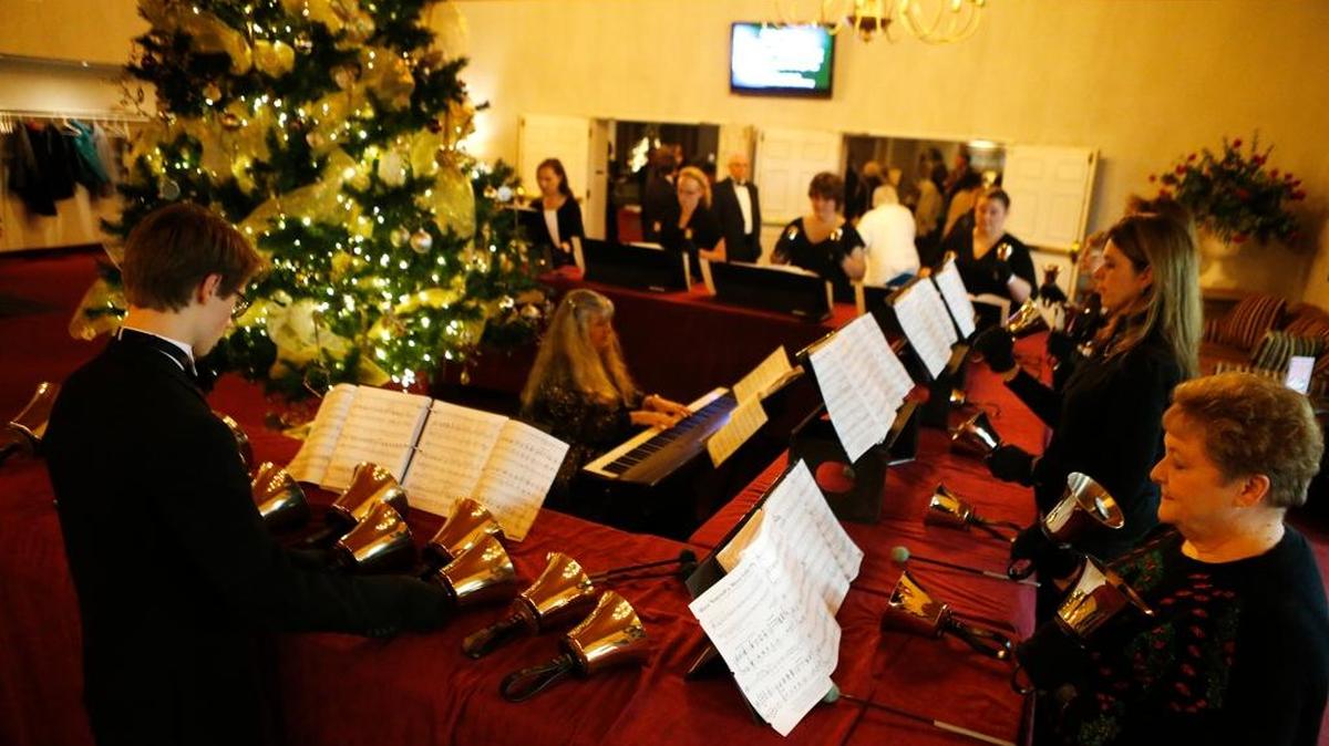 The handbell choir rehearses at St. Matthew Church in Belleville. At center is director Carrie Crago.