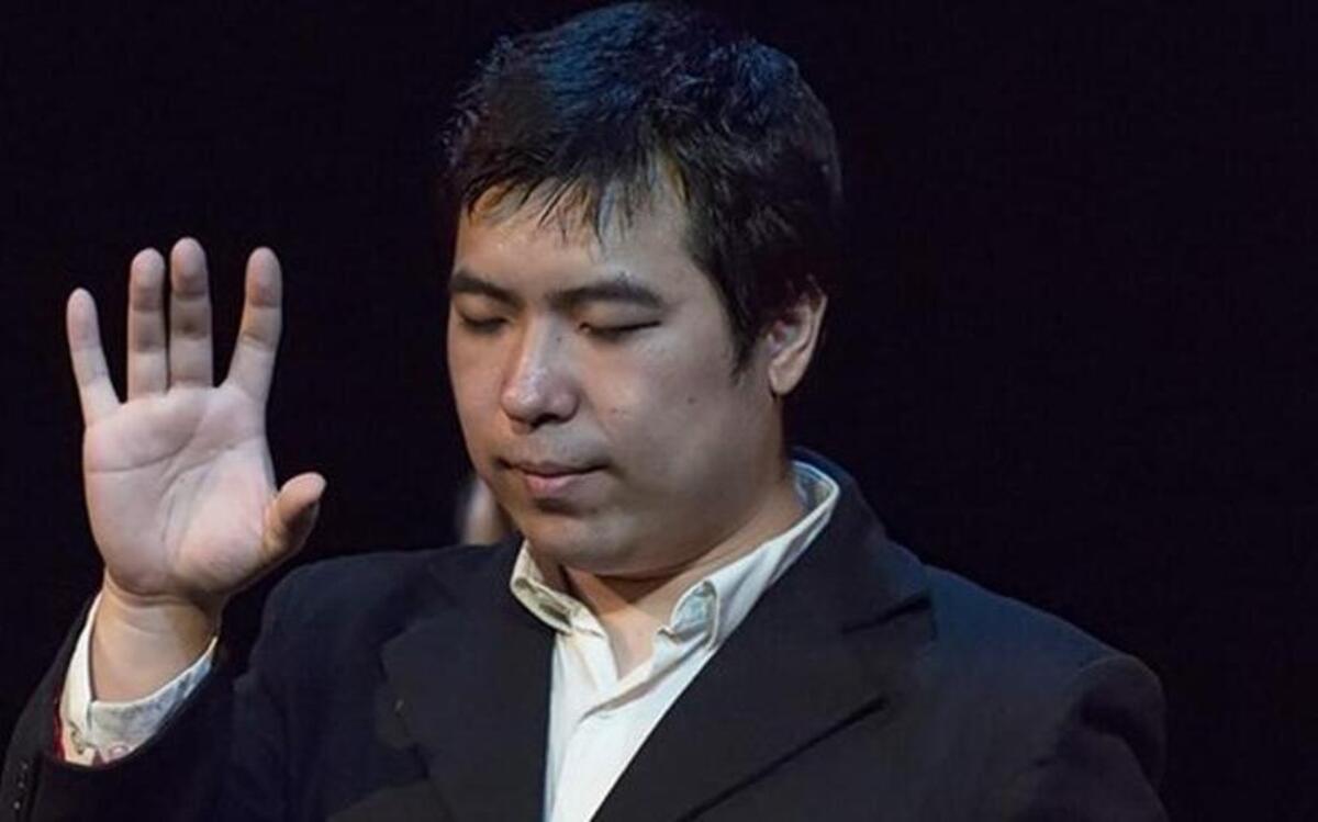 Professional magician Zi the Mentalist perform during the Magic of Christmas Dinner Show.