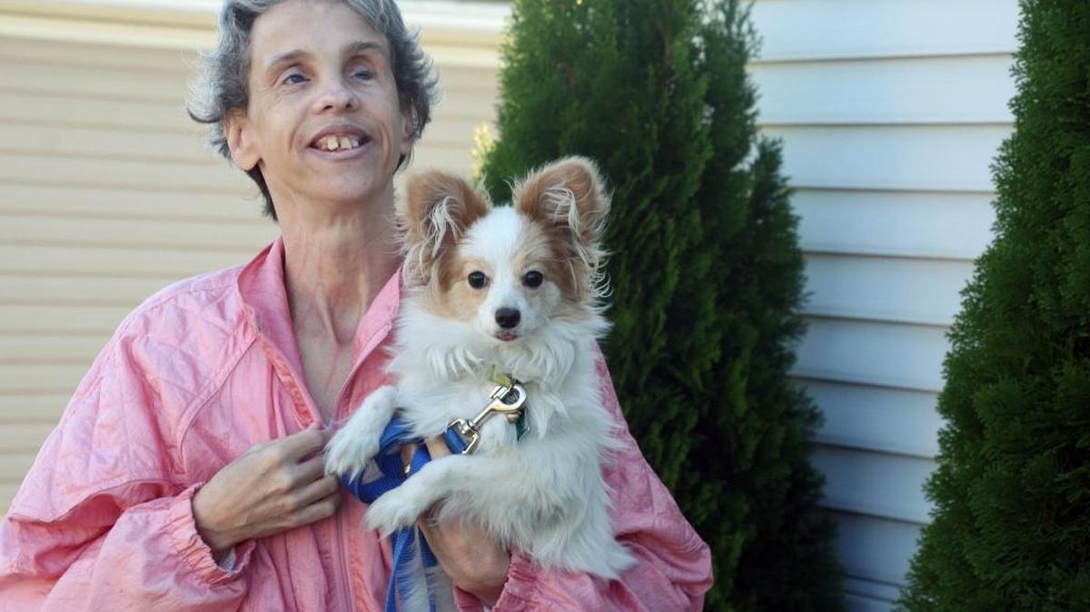 Dee Norenberg with Sierra, one of her three dogs. She and husband David live in Collinsville. Dee, who is blind, credits classes through Hadley School for the Blind with helping her become more independent.