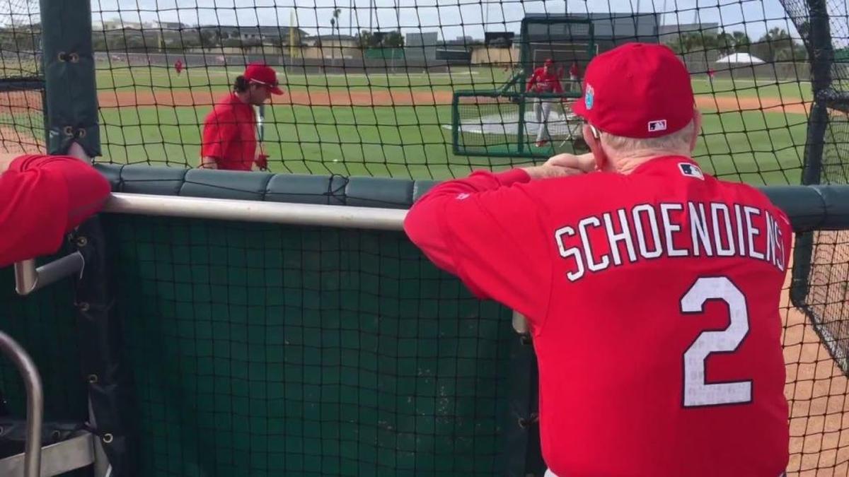 Red Schoendienst watches batting practice at Cardinals spring training.